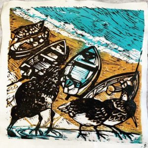 Three Turnstones on the sea wall